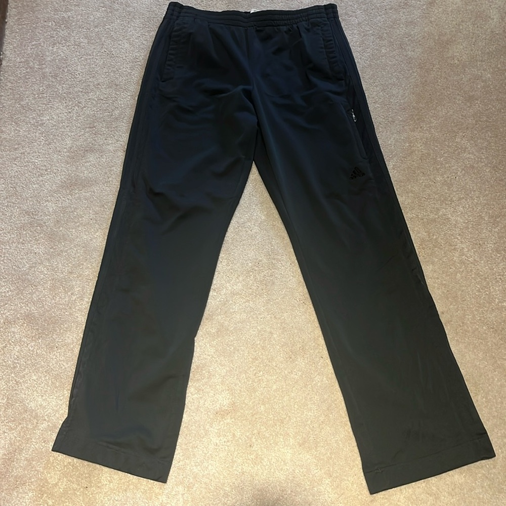 Large men’s dark gray adidas track pants with black stripes